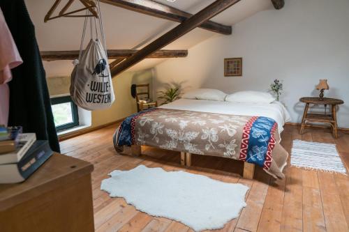 a bedroom with a bed in a room with wooden ceilings at Traditional House, view on lake, yoga, sauna R4543 in Sorradile