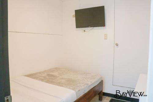 Ένα ή περισσότερα κρεβάτια σε δωμάτιο στο Bay View Inn