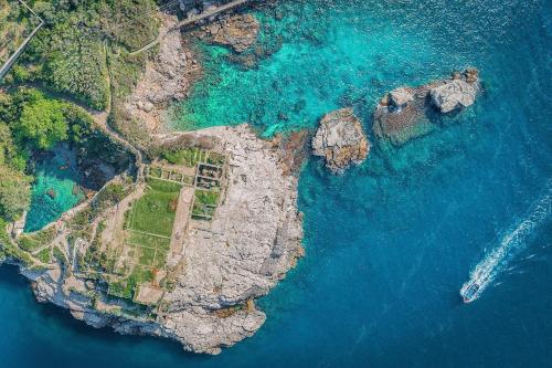an aerial view of an island in the ocean at Hotel Spicy in Sorrento