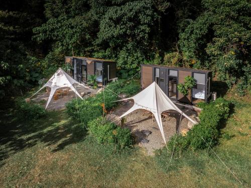 an aerial view of two tents in a field at Lanka 1 by Tiny Away in Ti-li