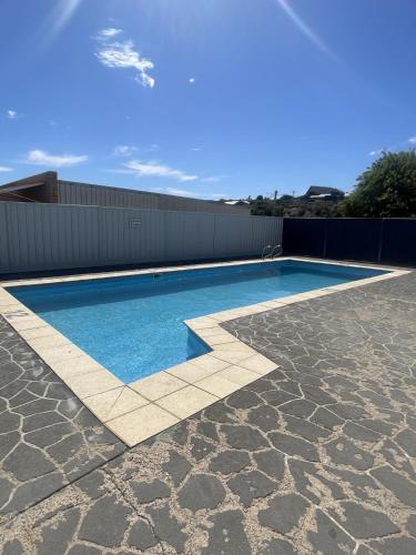 a swimming pool on top of a house at Waves Geraldton in Geraldton
