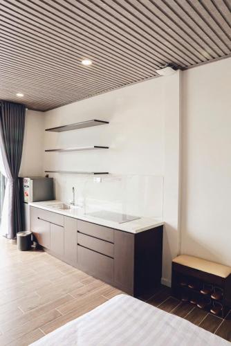 a kitchen with a sink and a counter top at Vĩnh Tuấn Hotel in Da Lat