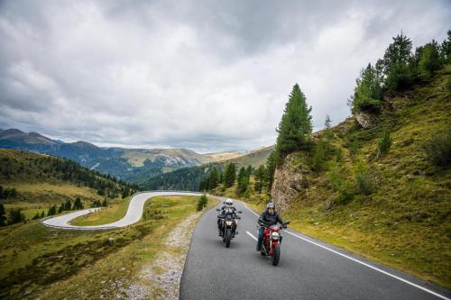 two people riding motorcycles on a winding road at Haus Zedlacher in Patergassen