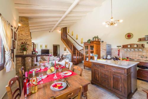 a kitchen and dining room with a wooden table at Villa Adonis by Villa Plus in Agnítsini