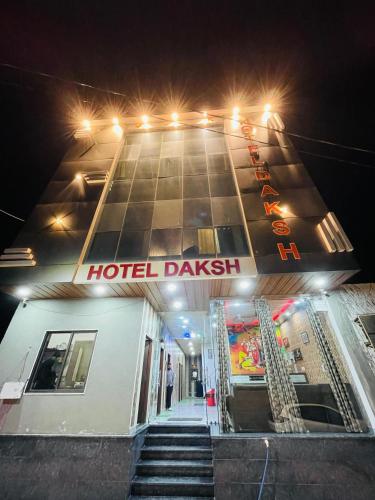 a hotel building with a sign on the front of it at Hotel Daksh in Khātu