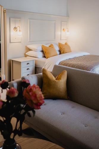 a living room with two beds and a couch at The Yorkshire Unicorn in Skipton