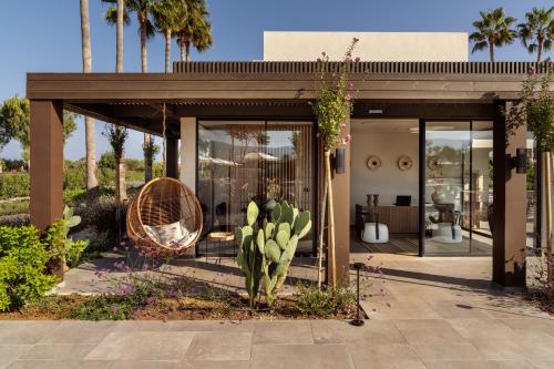 a house with a cactus in the front yard at The Ritual, A Wellness Retreat in Lampi