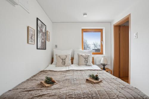 Postel nebo postele na pokoji v ubytování INN JOY Apartments - idyllische Bergsicht