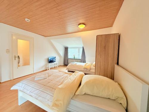 Zentrale Apartments in Rendsburg ideal für Monteure & Geschäftsreisendeにあるベッド