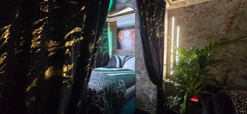 a dark room with a bed and a window at ZAJAZD ALBATROS Rzeszów SPA in Rzeszów