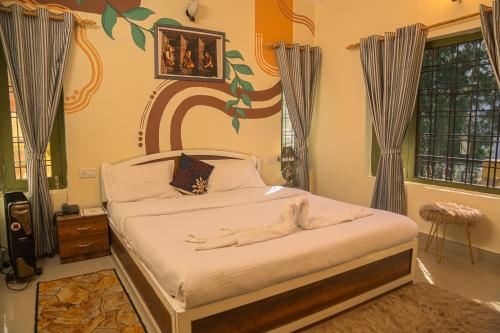 a bedroom with a large bed in a room at THEHIMALAYANLIVING WHISTLING PINES in Mukteswar
