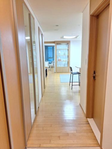 a hallway leading to a room with a table at Stella's Home in Seoul