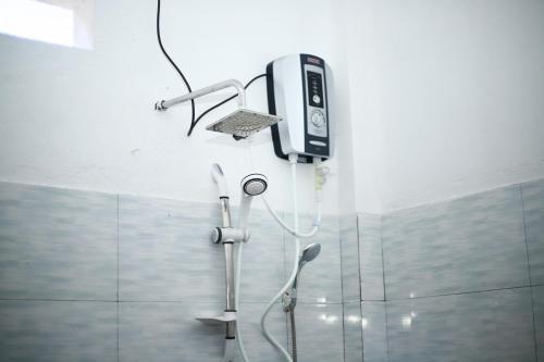a shower in a bathroom with a shower at Dilmalee Village in Dickwella