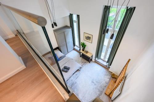 an overhead view of a living room with a couch at Cozy Lofts Next To Berliner Wall in Berlin