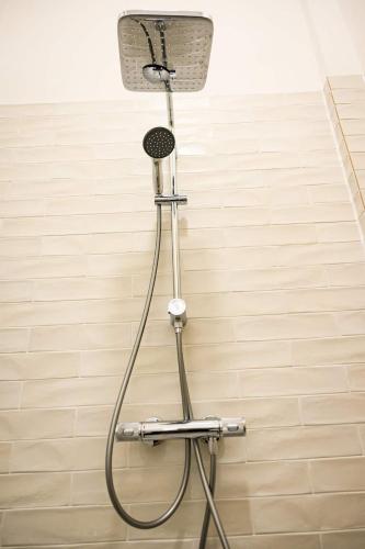 a shower in the corner of a bathroom at Cozy Lofts Next To Berliner Wall in Berlin