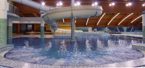 a water slide in a indoor swimming pool at Apartmán Frymburk in Frymburk
