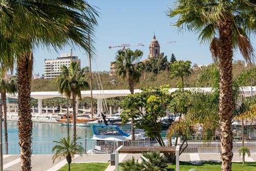 a view of a marina with palm trees at iloftmalaga Puerto in Málaga