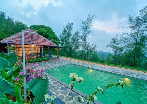 Bazén v ubytování Pine Malhar Pool Stay by VOYE HOMES nebo v jeho okolí