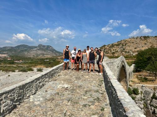 a group of people standing on a bridge at Bliss Inn Hostel & Tours in Shkodër