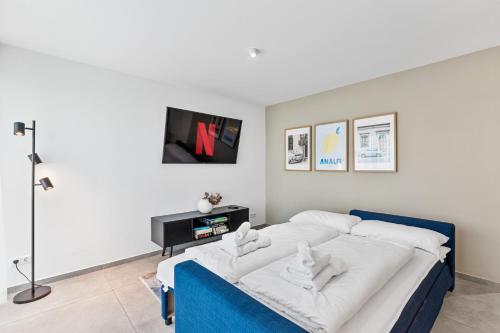 Ένα ή περισσότερα κρεβάτια σε δωμάτιο στο DaCasa Apartment zentral SmartTV