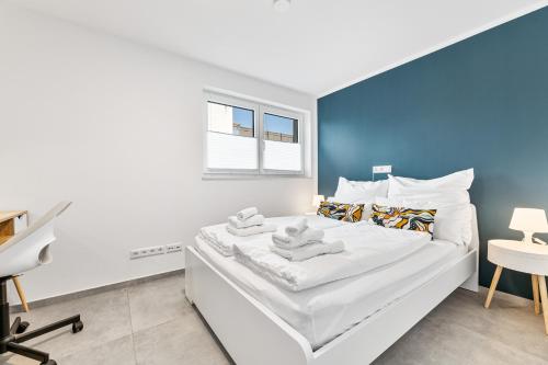 Ένα ή περισσότερα κρεβάτια σε δωμάτιο στο DaCasa Apartment zentral SmartTV