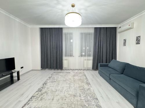 Posezení v ubytování Двухкомная квартира возле Байтерека