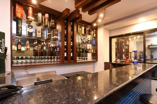 a bar with a lot of bottles of alcohol at Hotel Harmony in Kathmandu