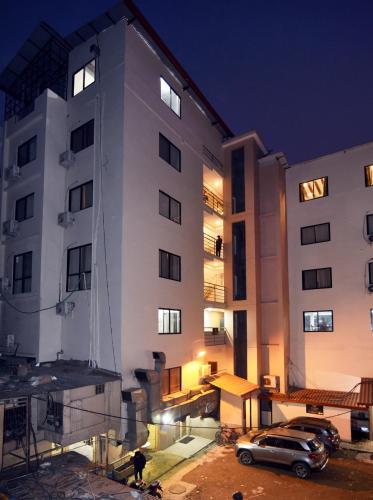 a building with a car parked in front of it at Hotel Harmony in Kathmandu