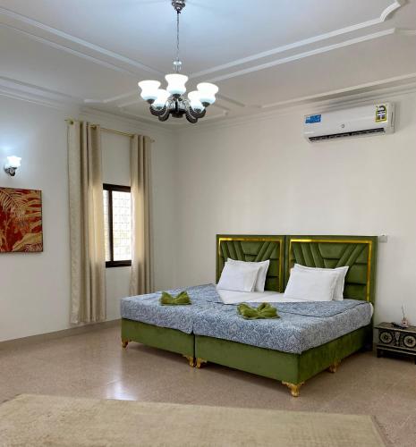 a bedroom with a large bed in a room at Arabian Nights Nook in Muscat