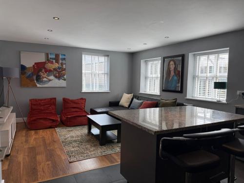 a kitchen and living room with a large counter top at Apartment in the Heart of Buxton in Buxton