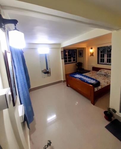 a small bedroom with a bed and a mirror at Silent Echo Farm Stay in Māngwa