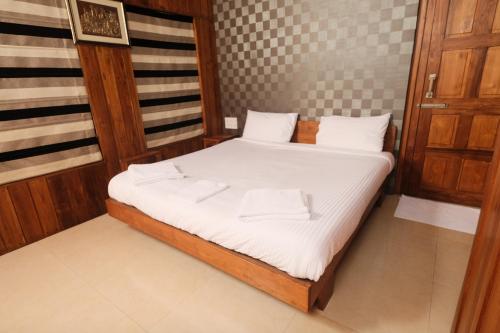 Letto o letti in una camera di Rainforest Resort