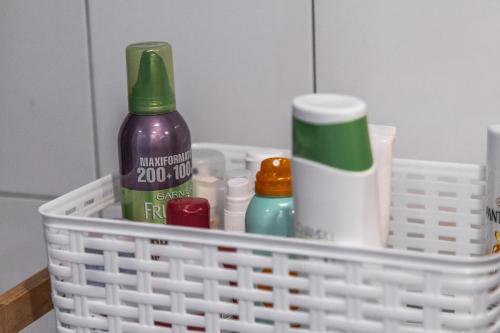 a white basket with toiletries on a counter at Santiago KM-0 in Santiago de Compostela