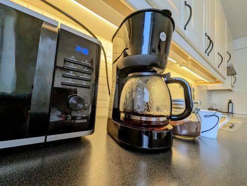 a blender sitting on a counter next to a microwave at Comfy room - Ski center - near Ås - 11 min to Oslo in Ski