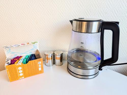 a blender sitting on a counter next to a box at Comfy room - Ski center - near Ås - 11 min to Oslo in Ski