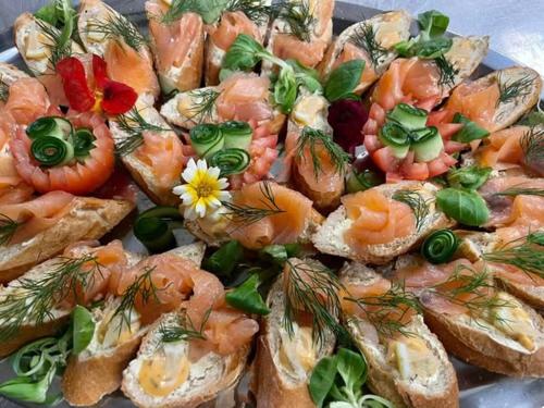 a plate of food with shrimp and other foods at Hotel U Kociana in Trojanovice