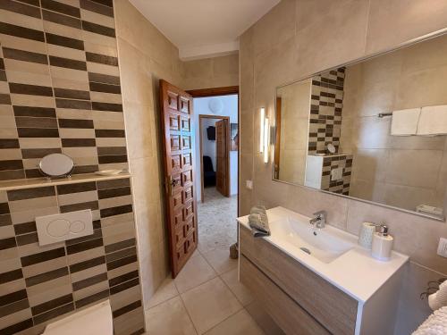 a bathroom with a sink and a mirror at Miramar3, Costa Calma, traumhafter Meerblick, max 2 Pers in Costa Calma