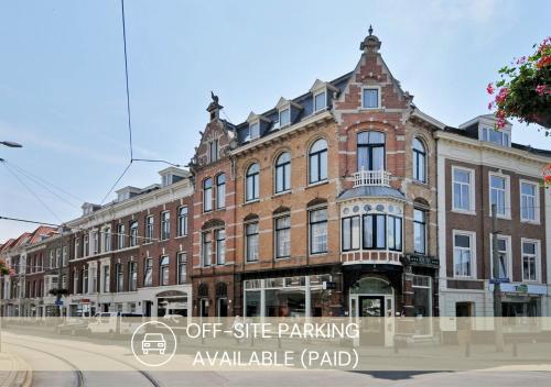 an old brick building on the corner of a street at Hotel Sebel in The Hague