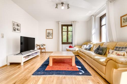 a living room with a couch and a coffee table at Bergwelten in Bludenz