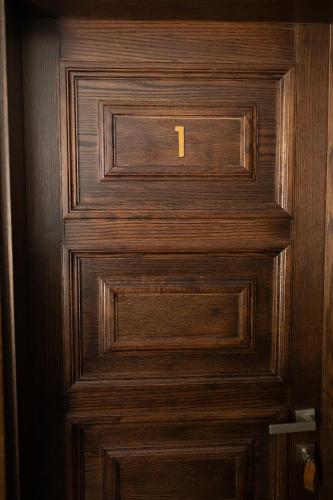 a wooden door with the number one on it at Синевирський Перевал in Synevyr
