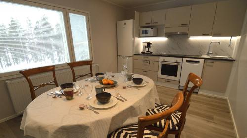 Kuchyň nebo kuchyňský kout v ubytování Guesthouse & Caravan Lehtiniemi - Posio