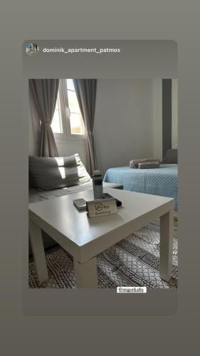a white coffee table in a living room at Dominik apartment in Patmos
