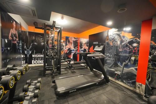 a gym with a treadmill and tread machines at Ramitos Hotel in Turunc
