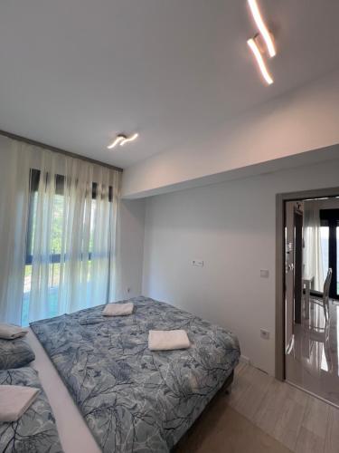 Vezo Apartment tesisinde bir odada yatak veya yataklar