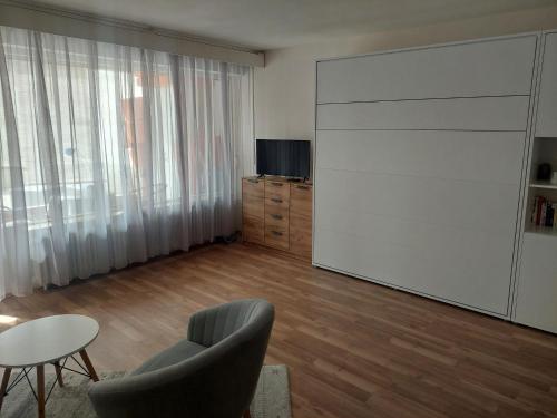 a living room with a large sliding door at Appartement Arend in Dobel