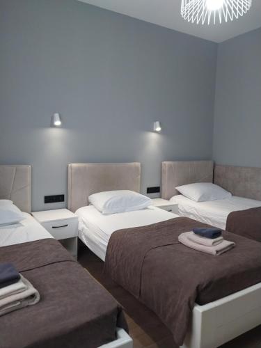 Ένα ή περισσότερα κρεβάτια σε δωμάτιο στο Hotel Korona