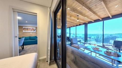 a living room with a view of a living room at Sea view BluEscape by Vellaris, Luxury Mobile Home in Mali Lošinj