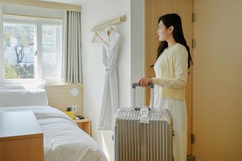 Postel nebo postele na pokoji v ubytování Hotel Marguerite Seoul