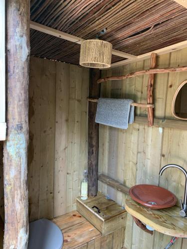 a wooden bathroom with a sink and a sink at Soul Farm Algarve - Glamping & Farm Houses in Aljezur