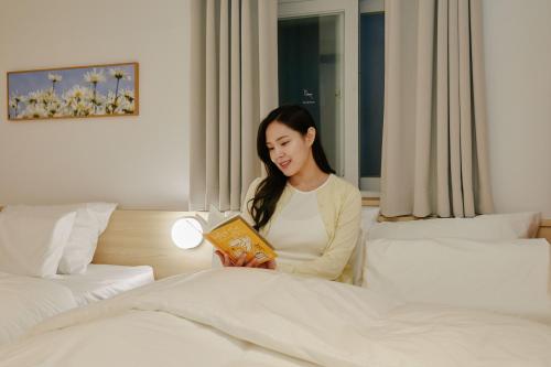 Cama o camas de una habitación en Hotel Marguerite Seoul